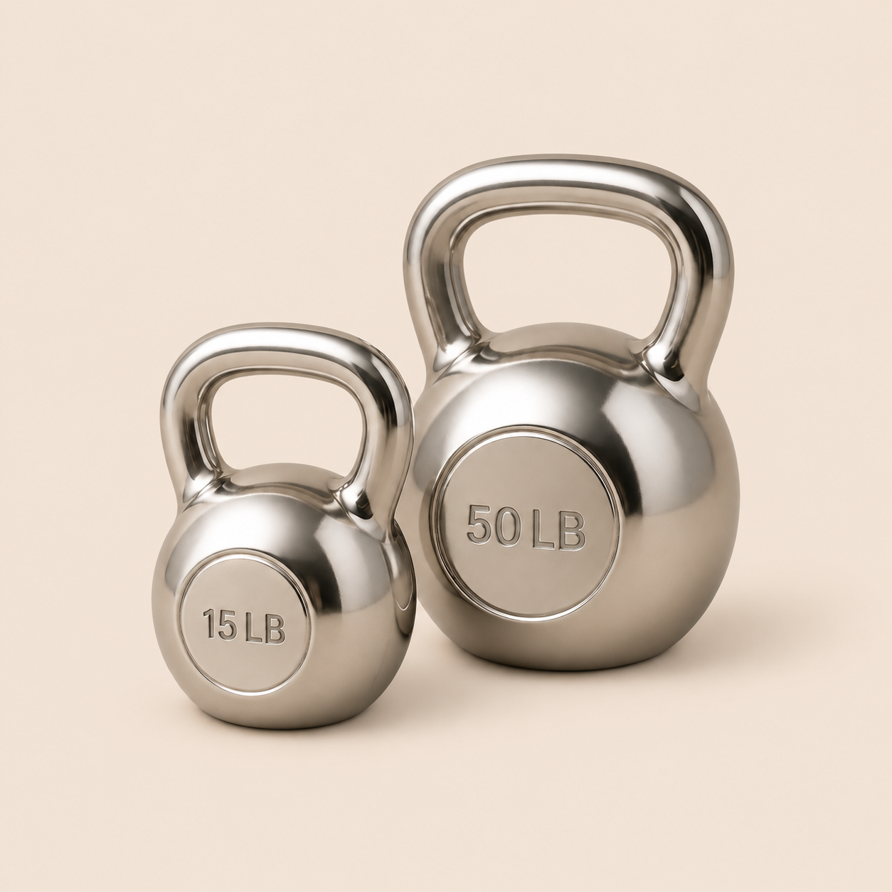Two chrome kettlebells labeled 15 LB and 50 LB.